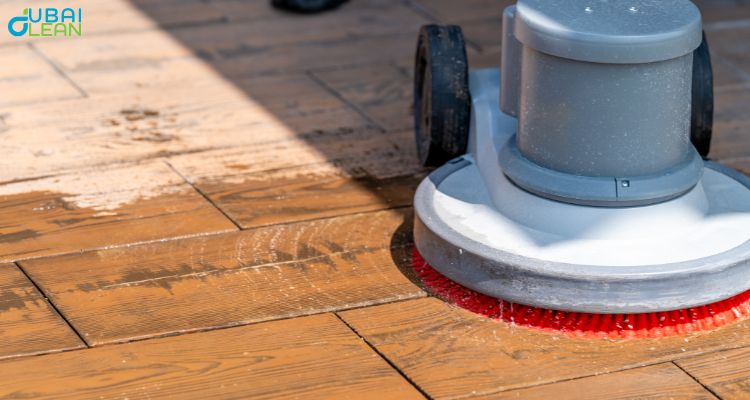 Modern floor cleaning machine in action on marble tiles in Dubai home interior with cleaning supplies