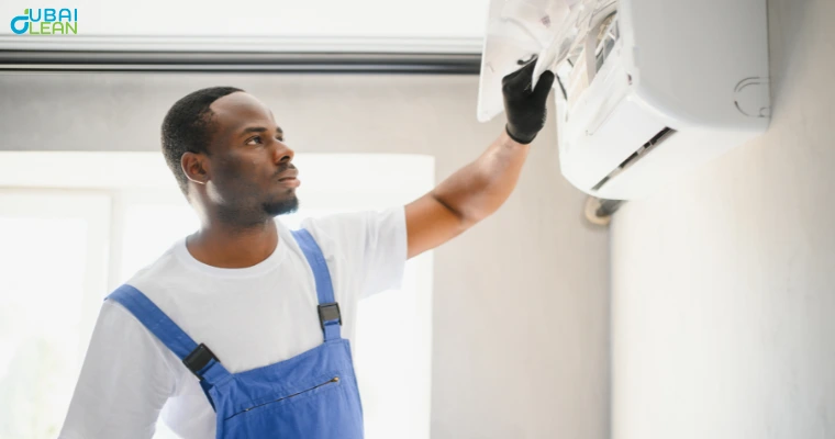 Technician performing AC cleaning services using professional tools and safety gear