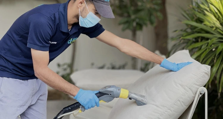 Professional sofa cleaning service removing stains and deep-set dirt from fabric upholstery.