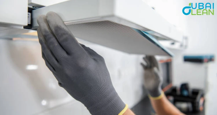 Kitchen hood cleaning in progress to remove grease buildup and improve fire safety
